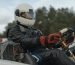 Go Kart Racer Wearing Protective Gears while Holding the Steering Wheel